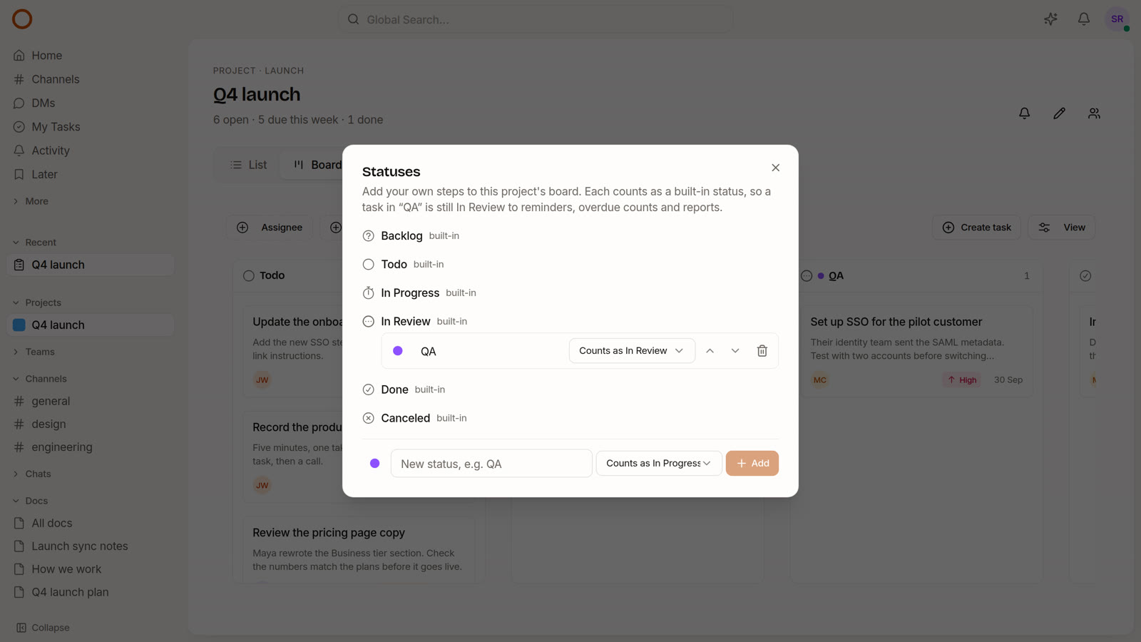 The Statuses dialog on the Q4 launch board, with a custom QA status that counts as In Review